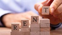 Holding Wooden Blocks Placing Last Alphabet Of Word