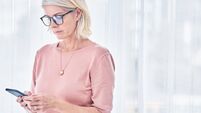 Shot of a senior woman using her cellphone at home