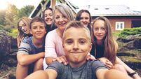 Grandson taking selfie of his grandmother and cousins