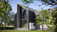 A modern barn house with a mezzanine, large windows, and a lovely terrace with a garden  - 3d render