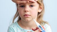 Checking fever on a small child