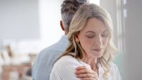 Mature couple fighting at home sitting on the sofa.