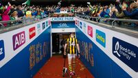 TJ Reid leaves the field dejected as Limerick manager John Kiely celebrates with the Liam MacCarthy Cup 23/7/2023