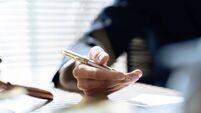 Close up lawyer hands holding pen, signing in white paper form or application to confirm and deal contract agreement