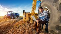 Farmer counts yields on a computer