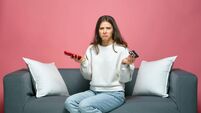 Upset young girl holding credit card, phone, cant make payment, have no money for shopping. E-commerce, online banking