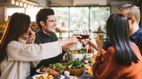 Dinner with friends. Group of young people enjoying dinner together. Dining Wine Cheers Party thanksgiving Concept
