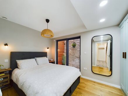 Main bedroom with French doors to small patio Main bedroom with French doors to small patio