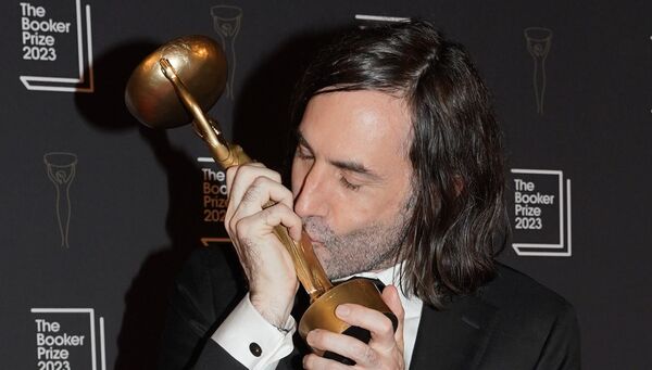 Paul Lynch kisses the trophy after being named as the winner of the 2023 Booker Prize. Paul Lynch kisses the trophy after being named as the winner of the 2023 Booker Prize.