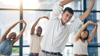 Team building, stretching and a team of business people in the office to workout for health or mobility together. Exercise, fitn
