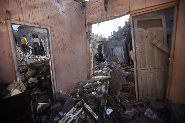 Palestinians look at destruction after the Israeli bombing In Khan Younis refugee camp in Gaza Strip on Friday (Picture: AP Photo/Mohammed Dahman) Palestinians look at destruction after the Israeli bombing In Khan Younis refugee camp in Gaza Strip on Friday (Picture: AP Photo/Mohammed Dahman)