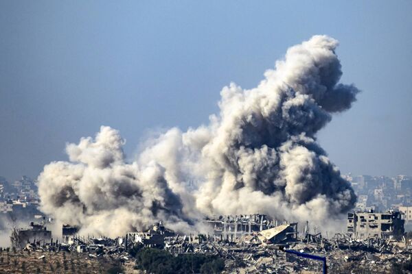 This picture taken from southern Israel near the border with the Gaza Strip shows smoke rising from buildings after being hit by Israeli strikes, as battles resume between Israel and Hamas militants, on December 1, 2023. Picture: JOHN MACDOUGALL/AFP via Getty Images This picture taken from southern Israel near the border with the Gaza Strip shows smoke rising from buildings after being hit by Israeli strikes, as battles resume between Israel and Hamas militants, on December 1, 2023. Picture: JOHN MACDOUGALL/AFP via Getty Images